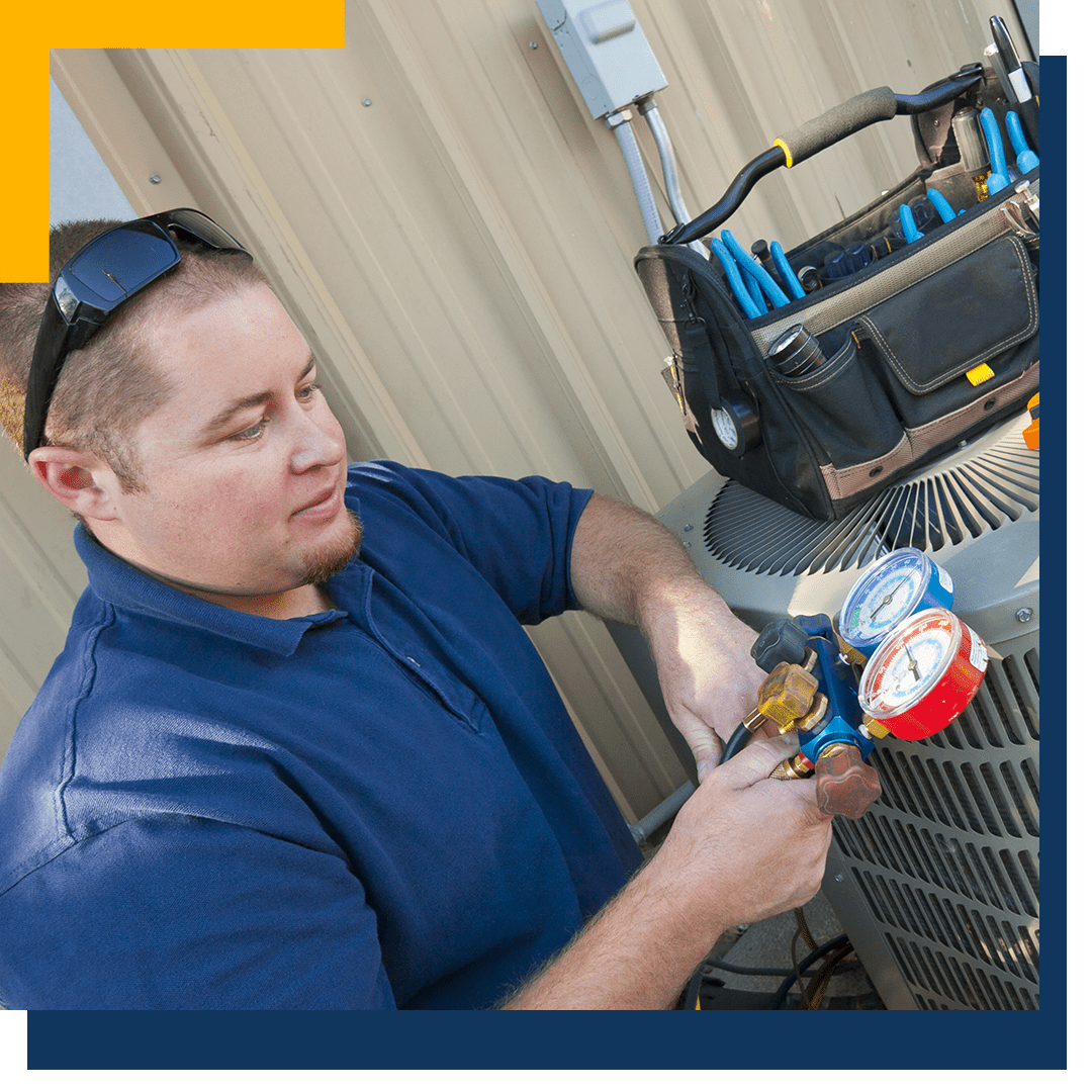 HVAC technician measures levels on an outdoor AC unit_