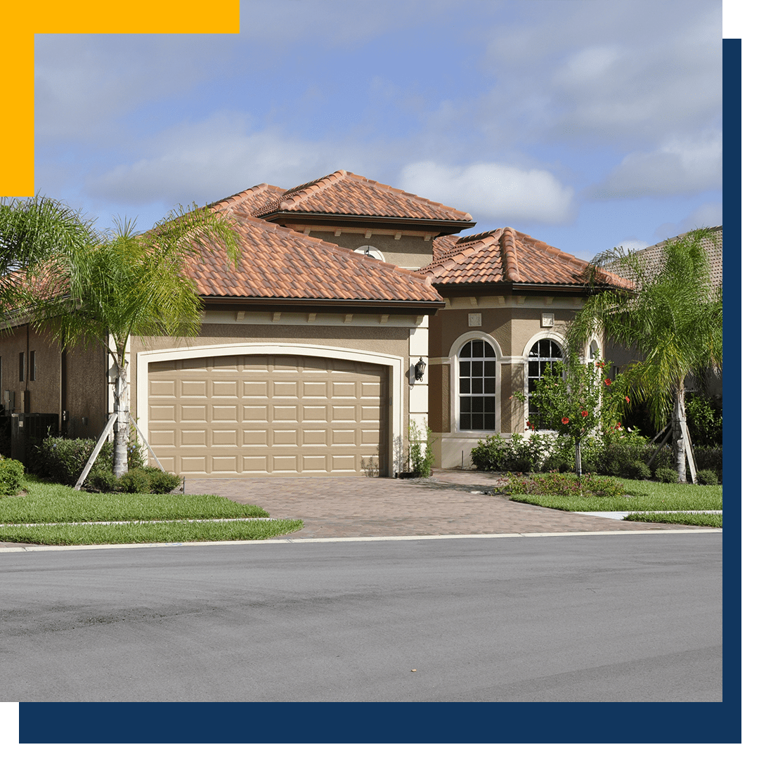 Residential home in Florida with palm trees in front yard_